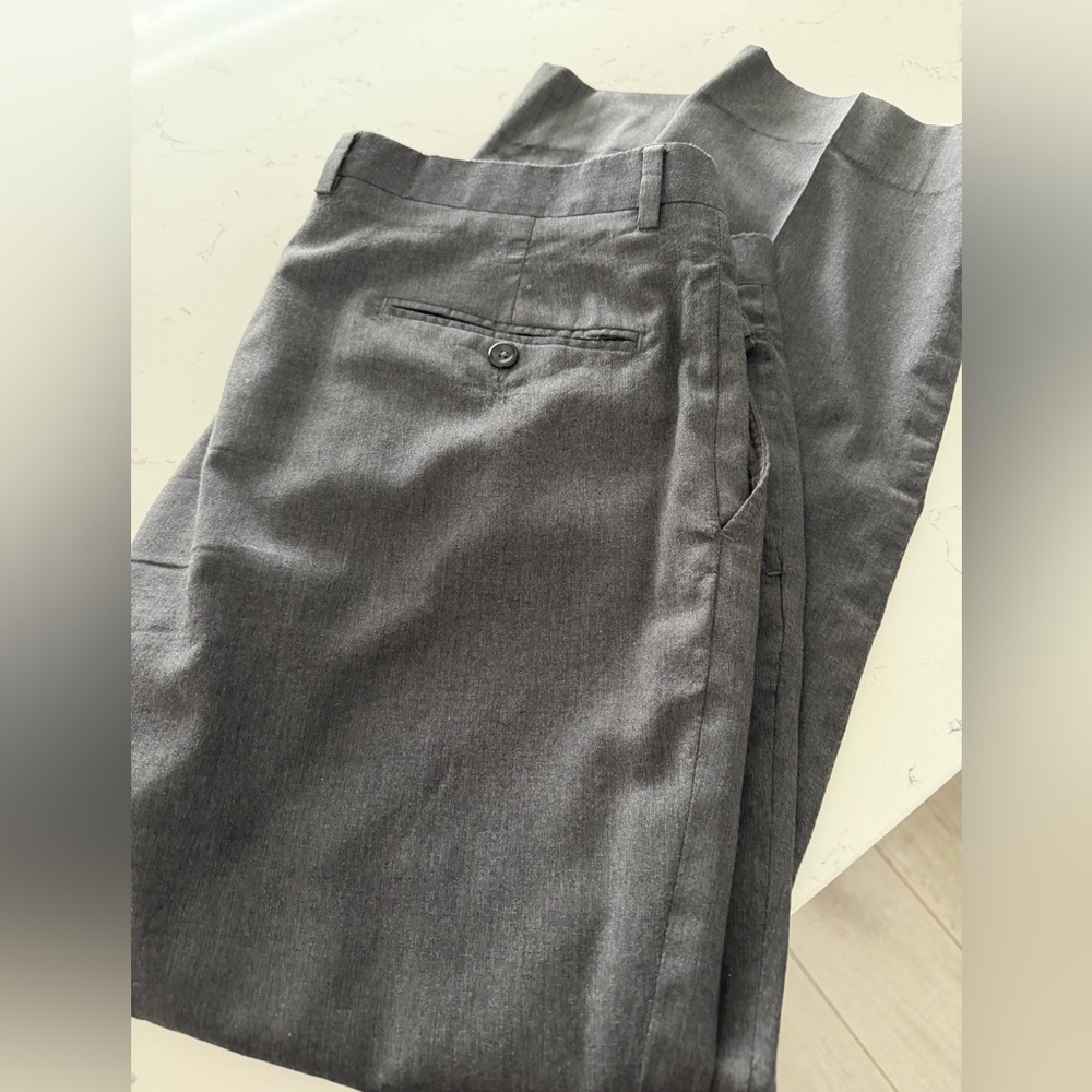 Men’s grey Jos A Banks tailored fit Travelers collection dress pants